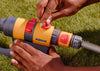 Person using a Hozelock garden Sprinkler on grass
