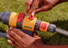 Person using a Hozelock garden Sprinkler on grass