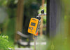 Hozelock timer on tap surrounded by greenery