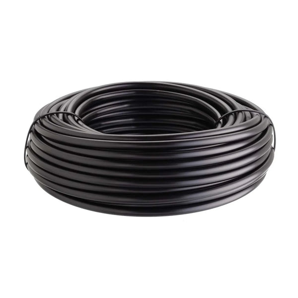Coiled black rubber irrigation pipe on a white background