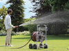 Claber Jumbo hose reel 8900 with person watering the Lawn