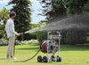 Claber Jumbo hose reel 8900 with person watering the Lawn