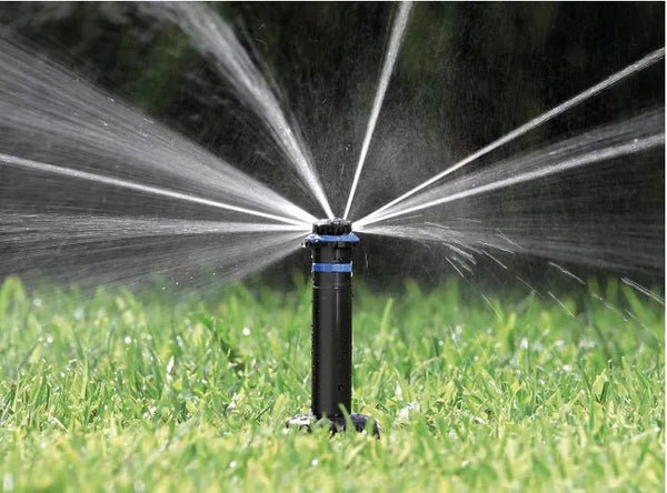 Claber 90266 Lawn Sprinkler in Lawn Spraying Water