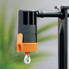 Claber irrigation device with a droplet on a blurred green background