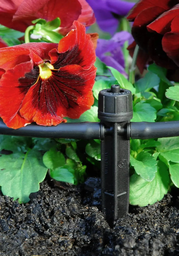 Antelco Ceta Inline Irrigation Dripper in flowerbed