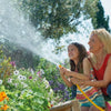 Children playing with water from a hose