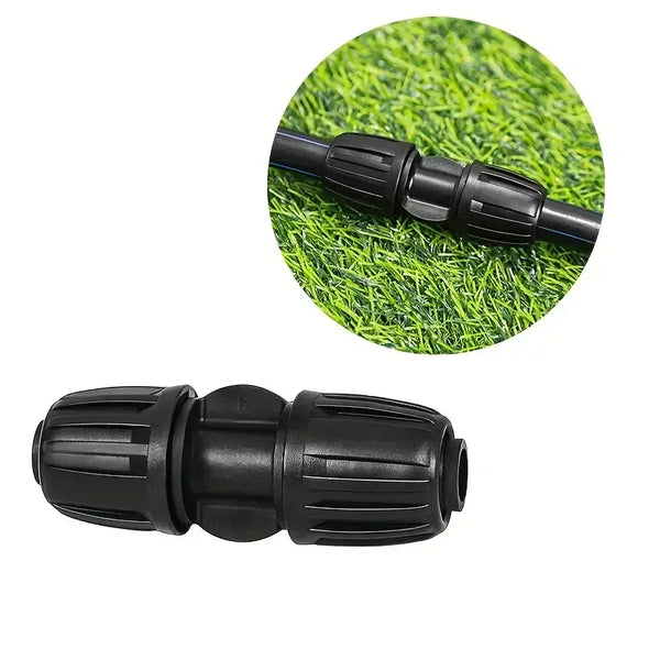 Black garden fitting on a grass background