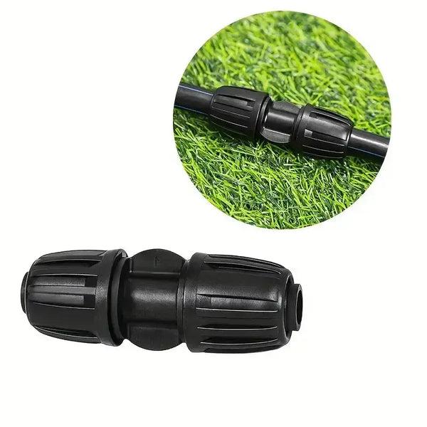 Black garden fitting on a grass background