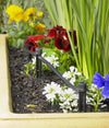 Garden bed with inline irrigation drippers