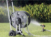 Claber Metal 60 Hose reel on grass with sprinkler in the background