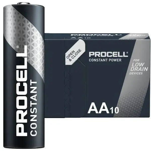 A ProCell Constant AA10 battery shown in front of its retail box on a plain white background. The battery is black with a silver geometric pattern and white branding, and the box is dark gray with matching branding and text indicating it is for low drain devices.