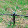Sprinkler spraying water on grass