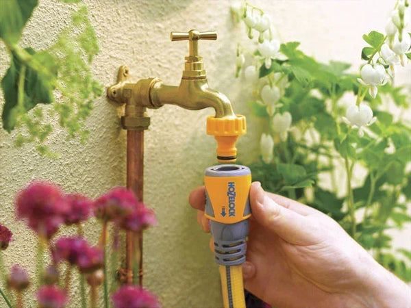 Hozelock tap connectors on garden wall