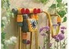 Hozelock 2150 multi tap adapter on garden wall with hose pipe