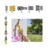 Set of garden hose nozzles and connectors with a hand holding a nozzle and a garden scene.