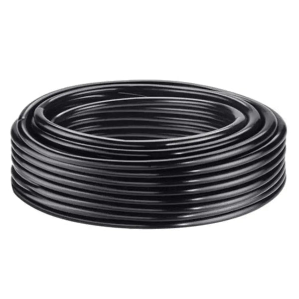 Coiled black irrigation tubing on a white background