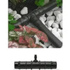 irrigation connector on white pebble flowerbed