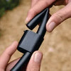 Close-up of hands holding pipe end closure for irrigation
