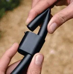 Close-up of hands holding pipe end closure for irrigation
