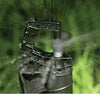 Sprinkler head spraying water on grass