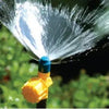 Sprinkler spraying water in a garden setting