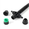 Set of black plastic garden irrigation components on a white background