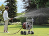 Claber Jumbo hose reel 8900 with person watering the Lawn