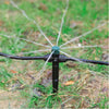 Sprinkler spraying water on grass